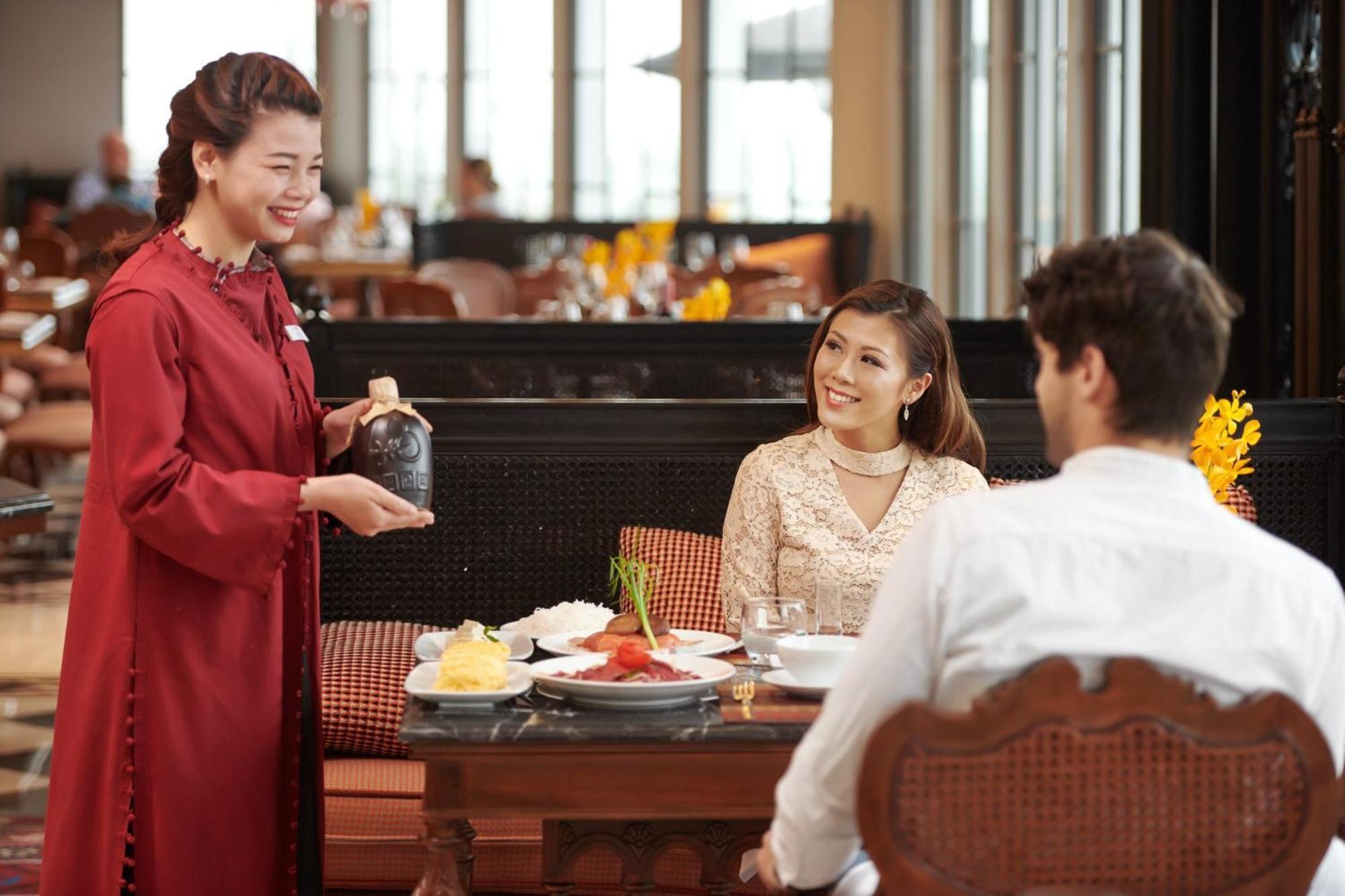 Silk Path Grand Sapa Resort & Spa Экстерьер фото A Thai waitress serving customers